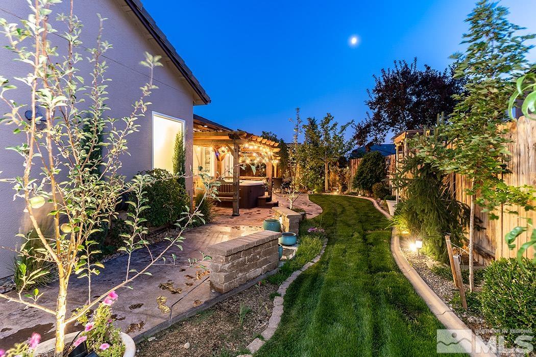10589 Twin Bridges Way Reno, NV 89521 - Photo 33 of 34 a view of a backyard with plants and a patio