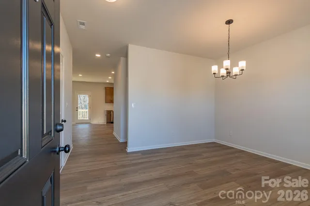a view of a livingroom with wooden floor