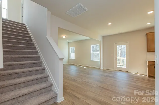 a view of an entryway with wooden floor