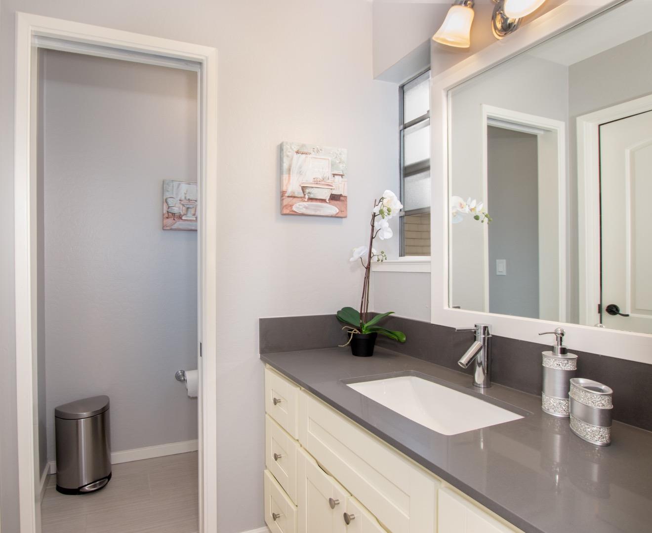 101 Redding Road, Unit C6 Campbell, CA 95008 - Photo 13 of 17 a bathroom with a granite countertop sink and a mirror