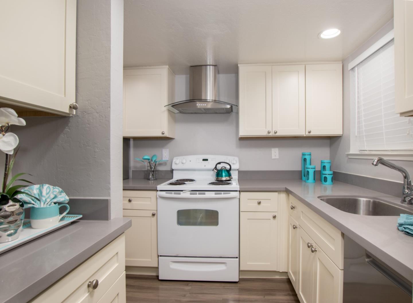 101 Redding Road, Unit C6 Campbell, CA 95008 - Photo 3 of 17 a kitchen with white cabinets stainless steel appliances and sink