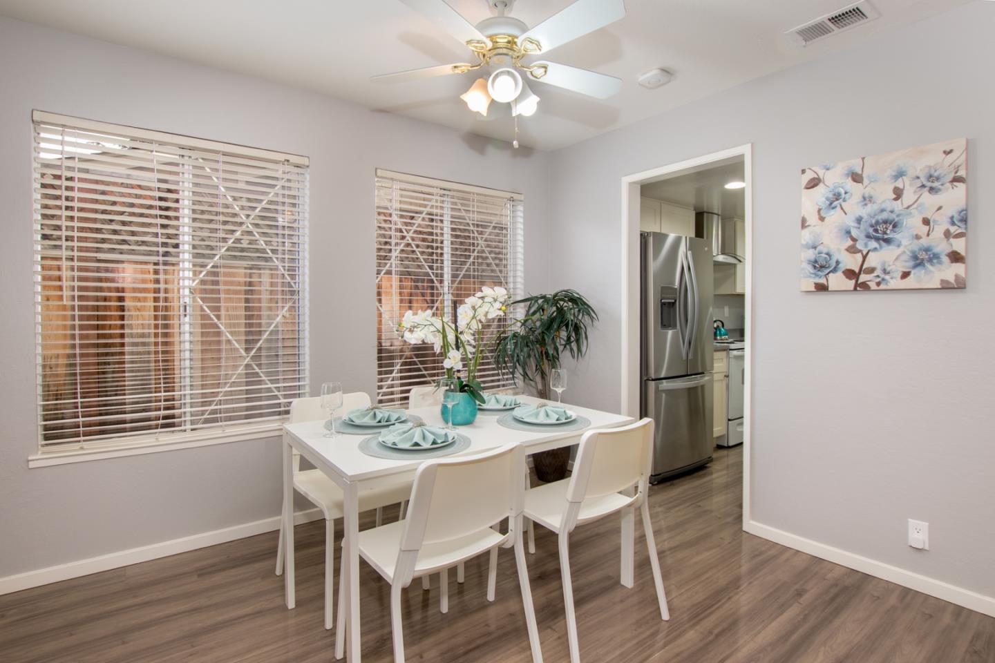 101 Redding Road, Unit C6 Campbell, CA 95008 - Photo 6 of 17 a view of a dining room with furniture window and wooden floor