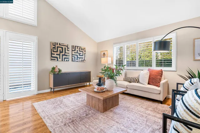 a close up of a white vase with white flowers
