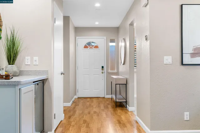 a kitchen with appliances a sink and cabinets