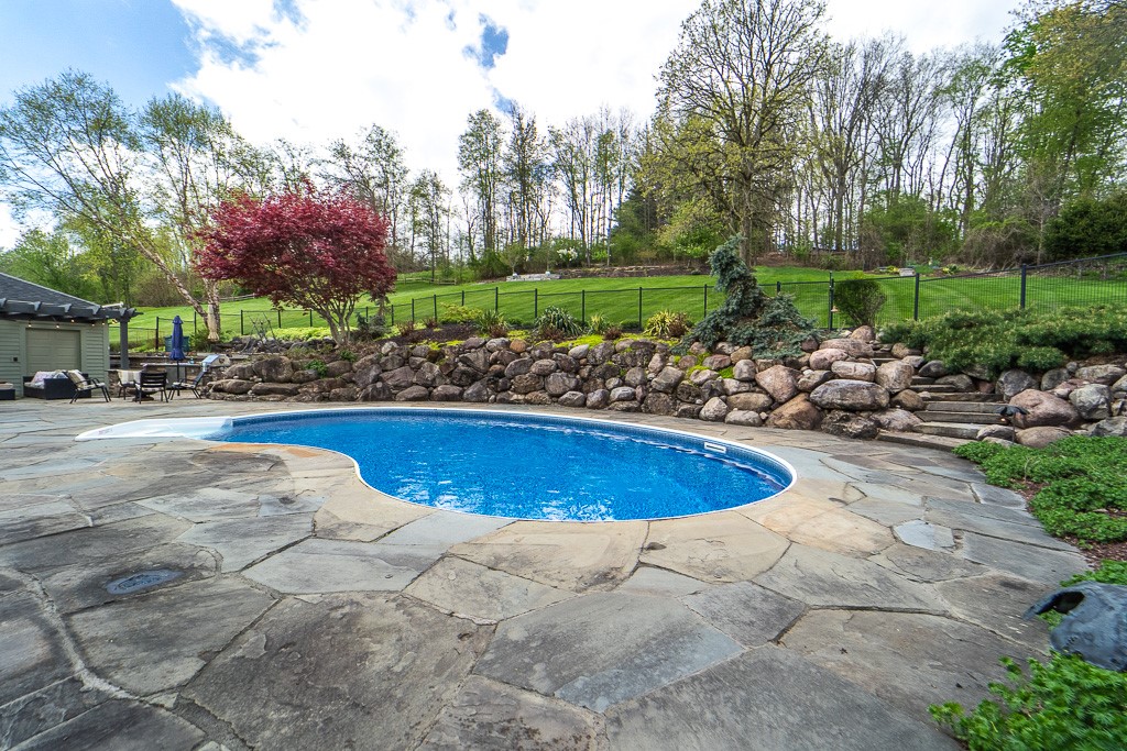 35 Thunder Ridge Drive Rush, NY 14543 - Photo 11 of 49 The in-ground pool with new liner, built-in speake