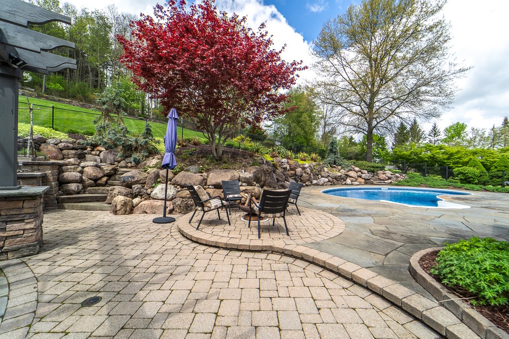 35 Thunder Ridge Drive Rush, NY 14543 - Photo 12 of 49 Tiered landscaping, a changing room, wired fencing