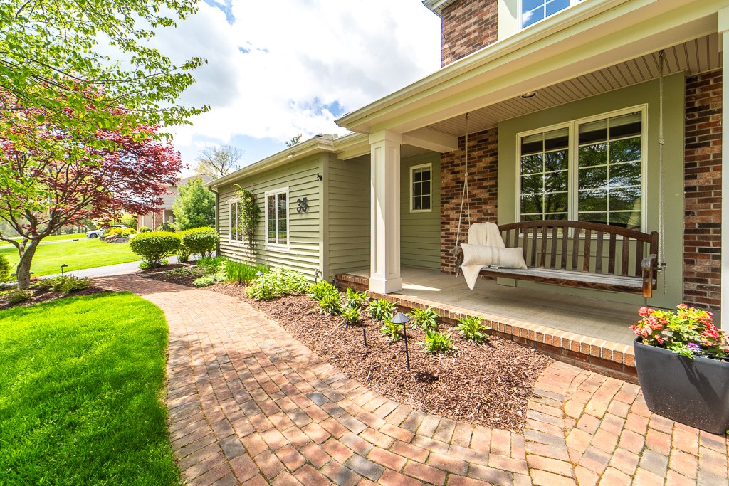 35 Thunder Ridge Drive Rush, NY 14543 - Photo 4 of 49 A wraparound porch with a charming swing creates a