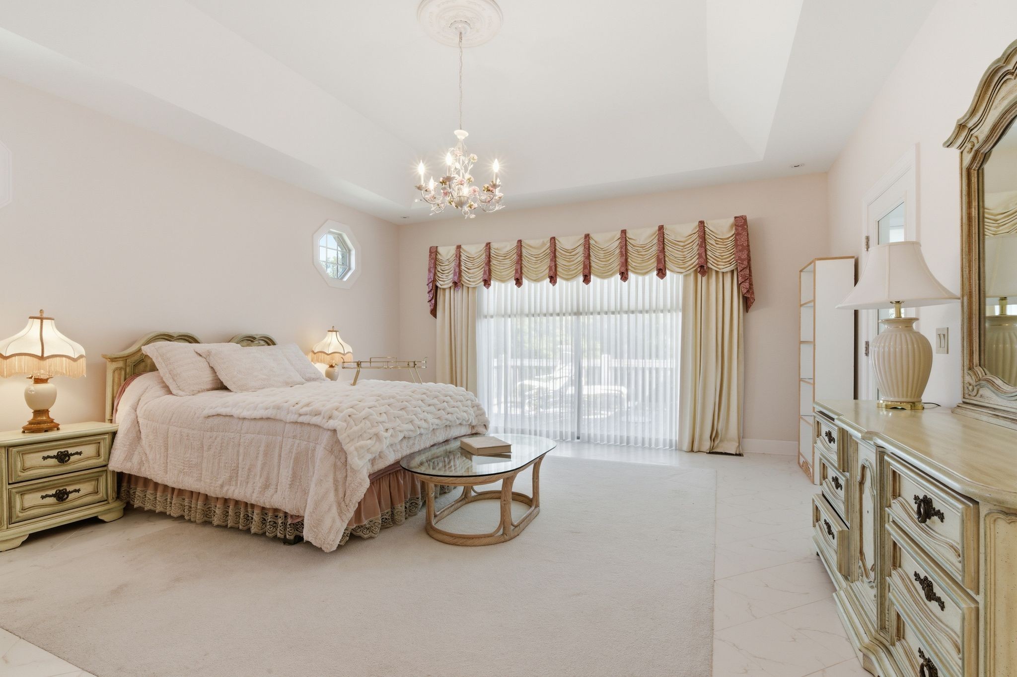 528 Country Club Drive Dickson, TN 37055 - Photo 35 of 55 a spacious bedroom with a bed and a chandelier
