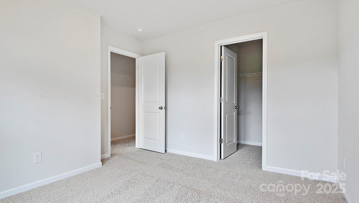385 Lagoon Road Fletcher, NC 28732 - Photo 22 of 30 a view of an empty room and closet area