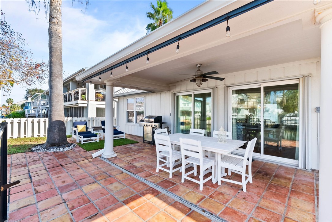 21 Flamingo Road Rockport, TX 78382 - Photo 20 of 30 a view of a dining room with furniture fire place and wooden floor