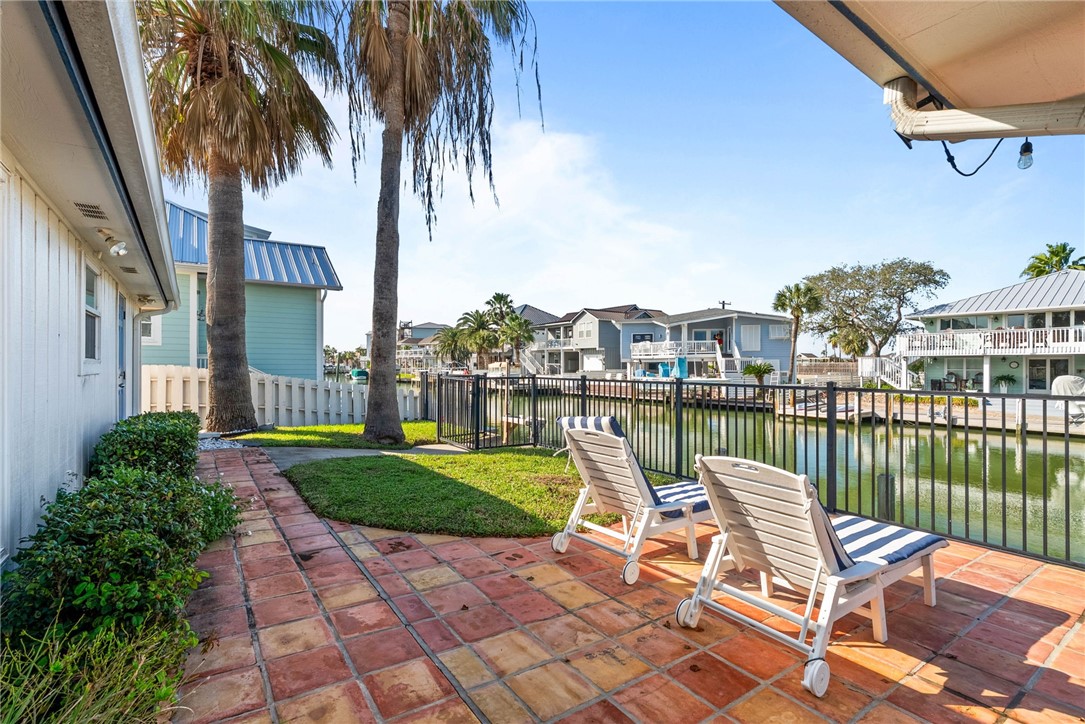 21 Flamingo Road Rockport, TX 78382 - Photo 22 of 30 a view of a chair and tables in the patio