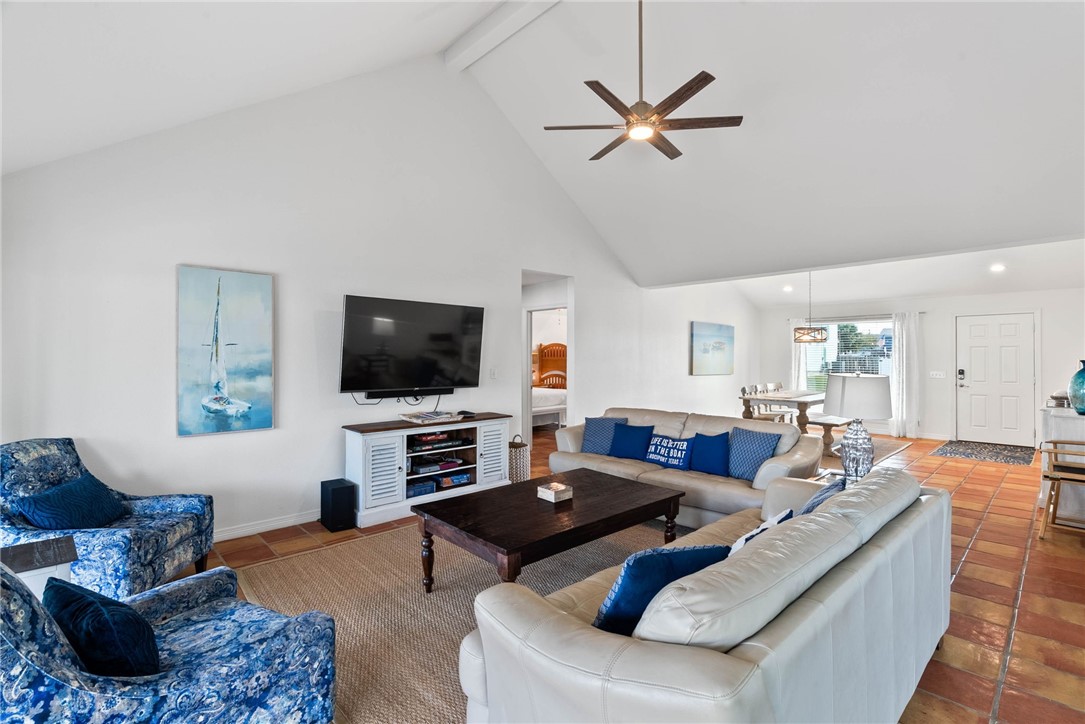 21 Flamingo Road Rockport, TX 78382 - Photo 7 of 30 a living room with furniture and a flat screen tv