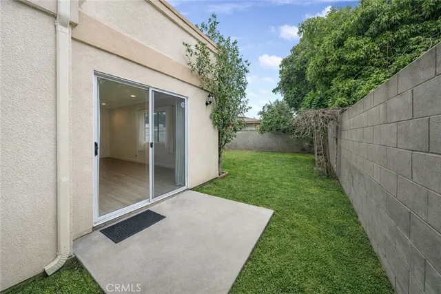 a view of backyard with patio