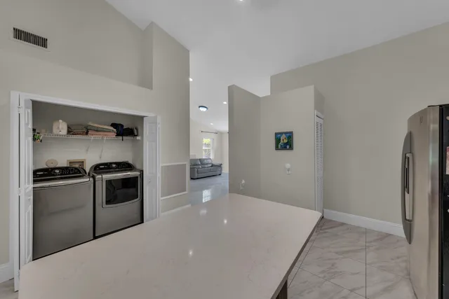 a kitchen with a stove and a refrigerator