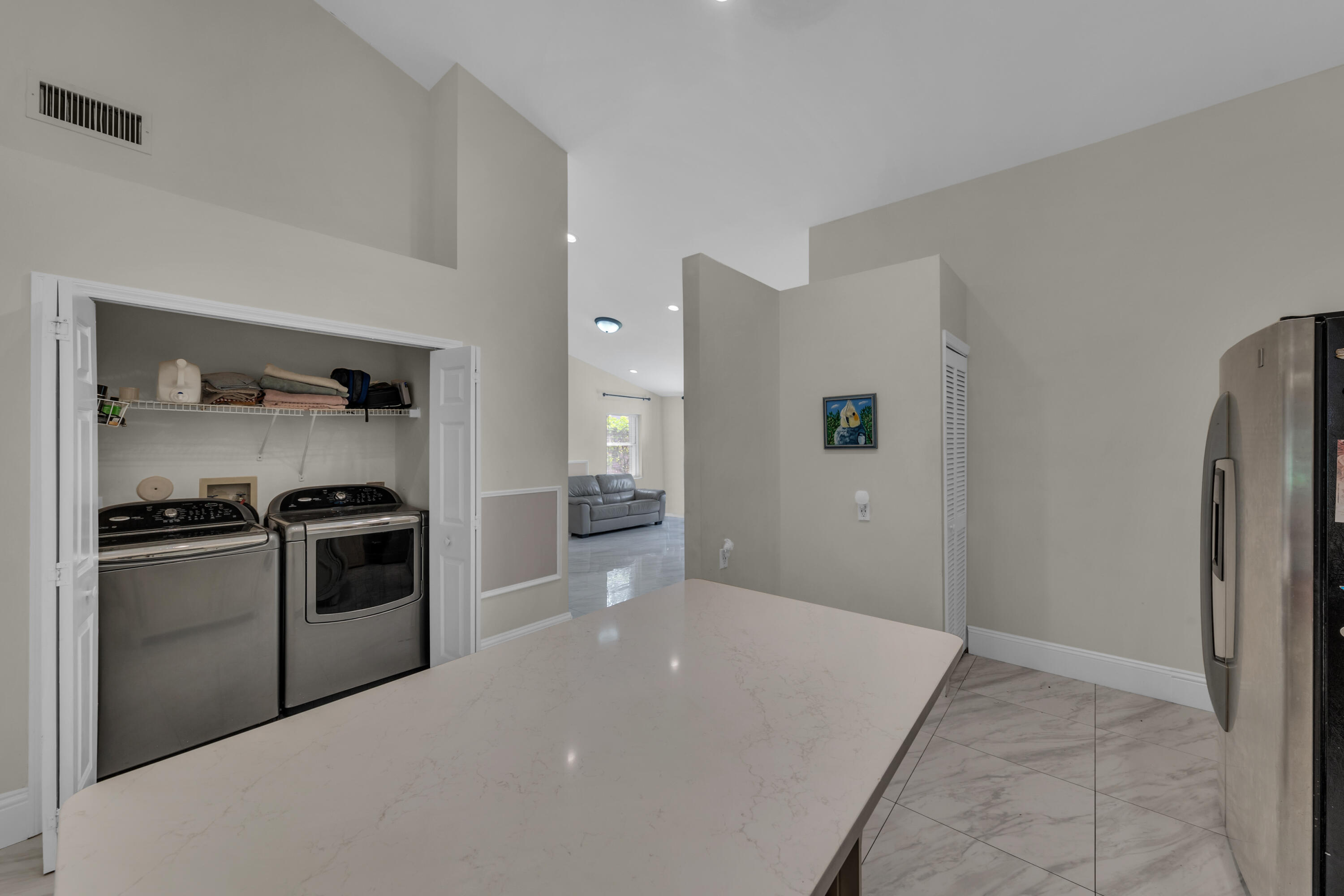 19623 Back 9 Drive Boca Raton, FL 33498 - Photo 14 of 24 a kitchen with a stove and a refrigerator