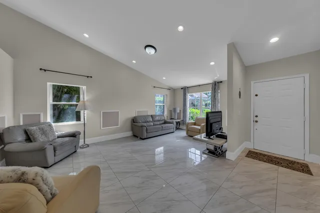 a living room with furniture gym and a window