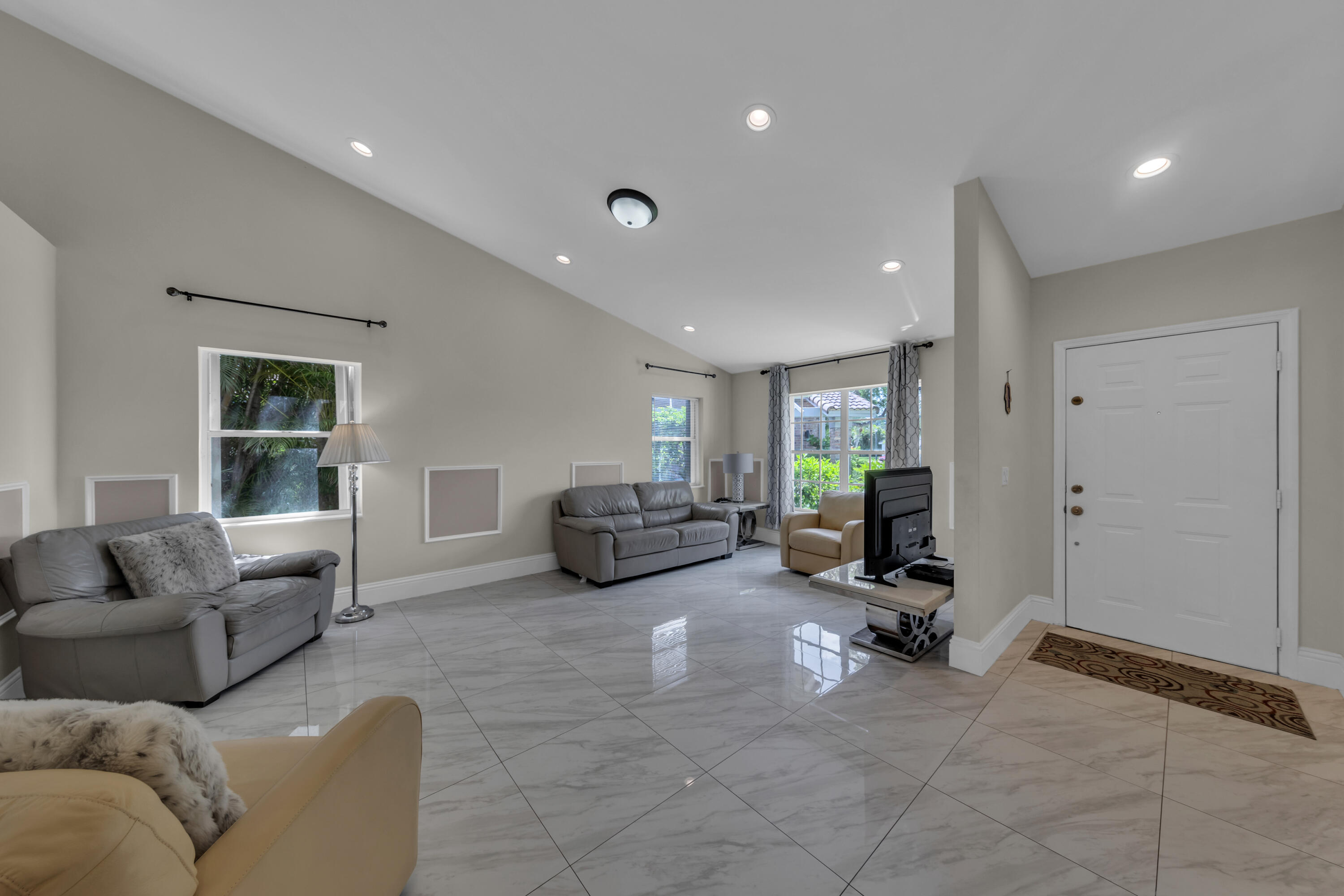 19623 Back 9 Drive Boca Raton, FL 33498 - Photo 2 of 24 a living room with furniture gym and a window