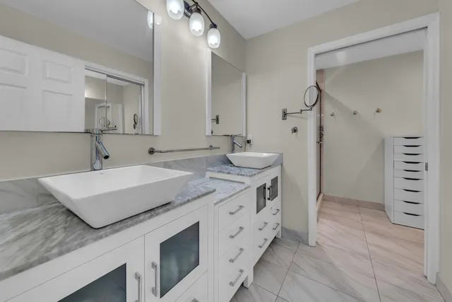a bathroom with a sink a vanity and a mirror