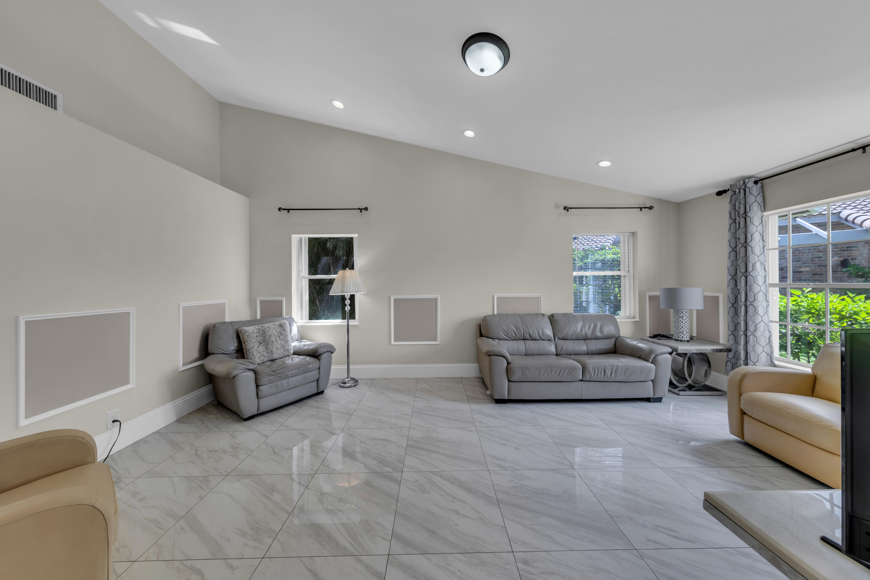 19623 Back 9 Drive Boca Raton, FL 33498 - Photo 3 of 24 a living room with furniture and a large window