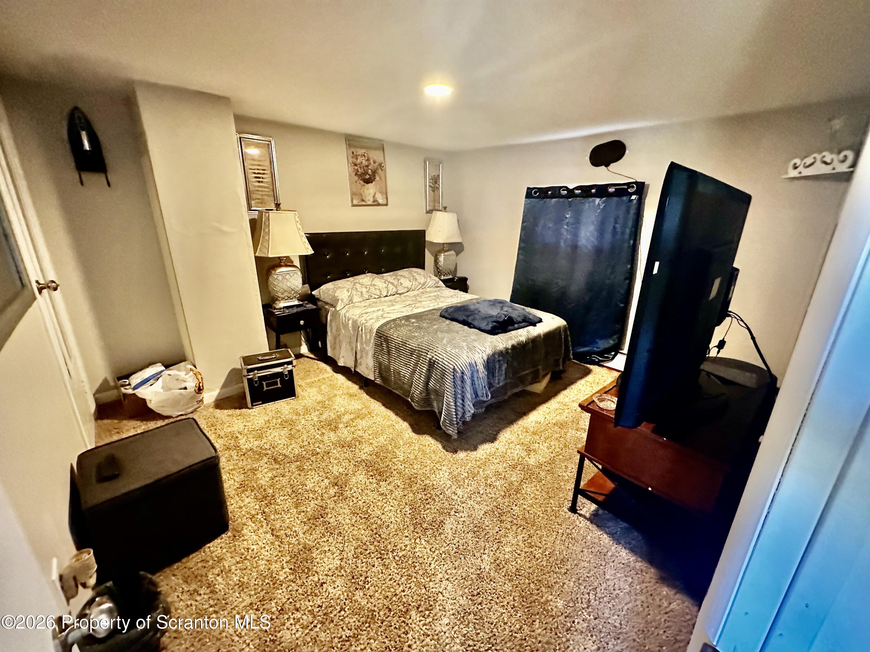 1727 Bulwer Street Scranton, PA 18504 - Photo 28 of 40 a bedroom with bed and wooden floor