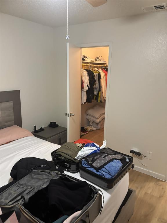 2200 East Trinity Mills Road, Unit 715 Carrollton, TX 75006 - Photo 16 of 31 a bedroom with a bed and a stove