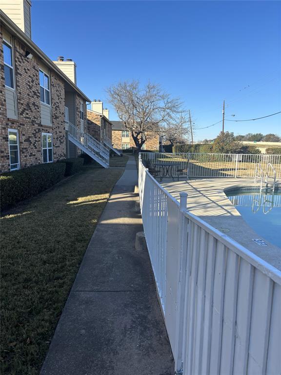2200 East Trinity Mills Road, Unit 715 Carrollton, TX 75006 - Photo 28 of 31 a view of a balcony with an outdoor space