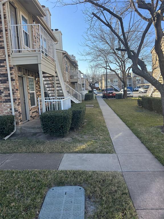 2200 East Trinity Mills Road, Unit 715 Carrollton, TX 75006 - Photo 29 of 31 a view of a yard in front of a building