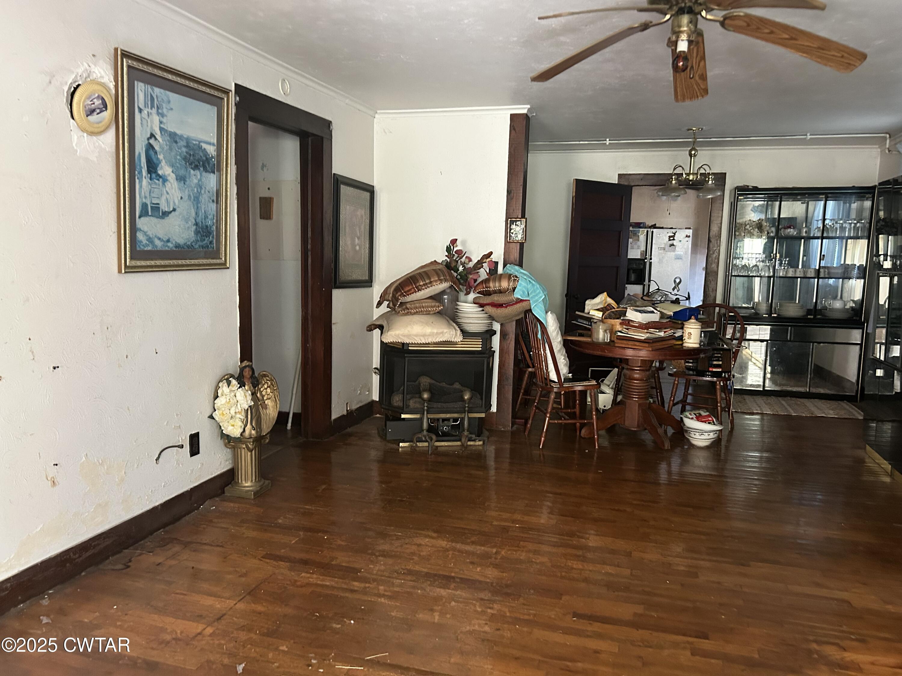 3084 West Jackson Street Milan, TN 38358 - Photo 4 of 11 a dining room with furniture floor to ceiling window and wooden floor