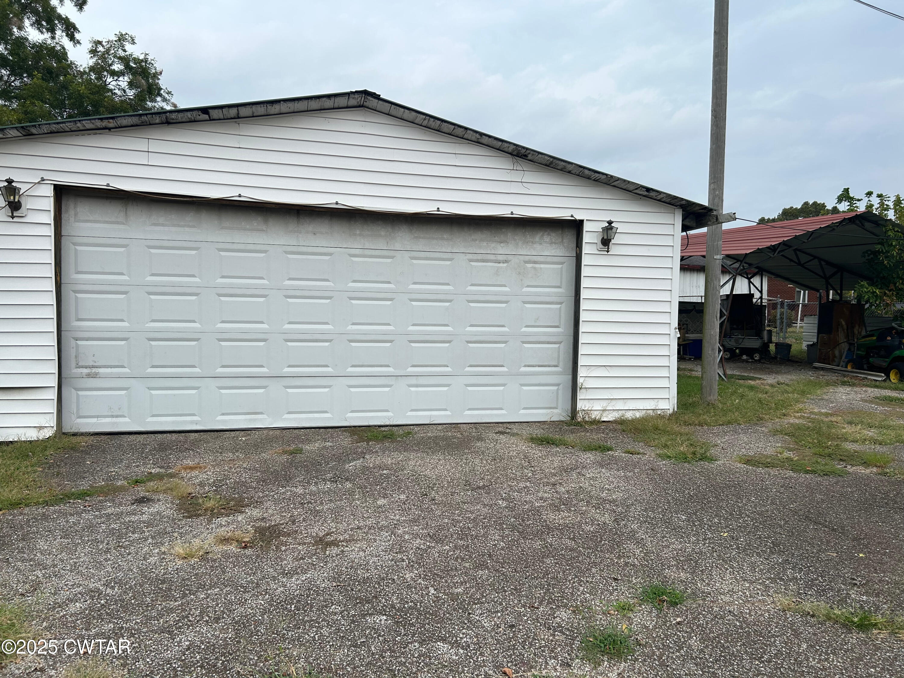 3084 West Jackson Street Milan, TN 38358 - Photo 8 of 11 a view of a house with a backyard