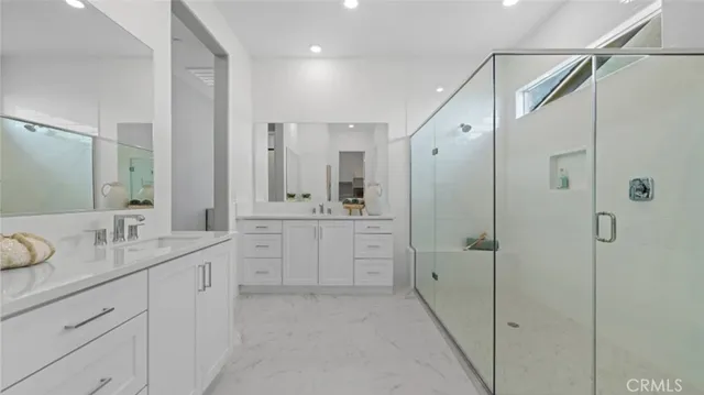 a bathroom with a shower and a sink