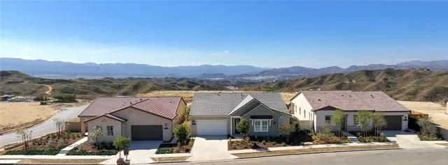 an aerial view of a house with outdoor space