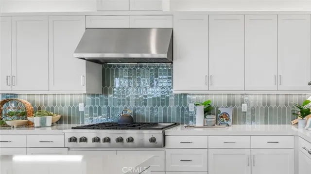 a kitchen with a stove and cabinets