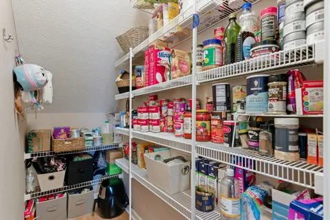 a bathroom with double vanity sink and a mirror