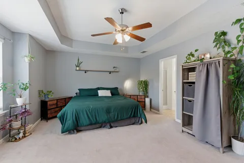 a bathroom with a bathtub sink and mirror
