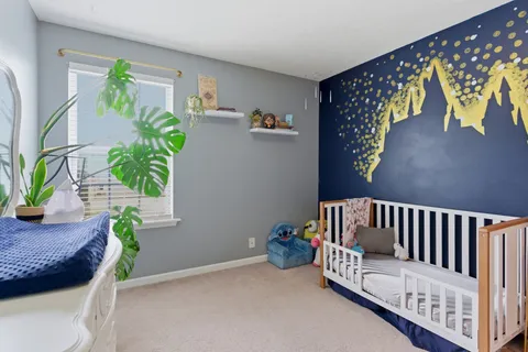 a view of a backyard with sitting area and garden