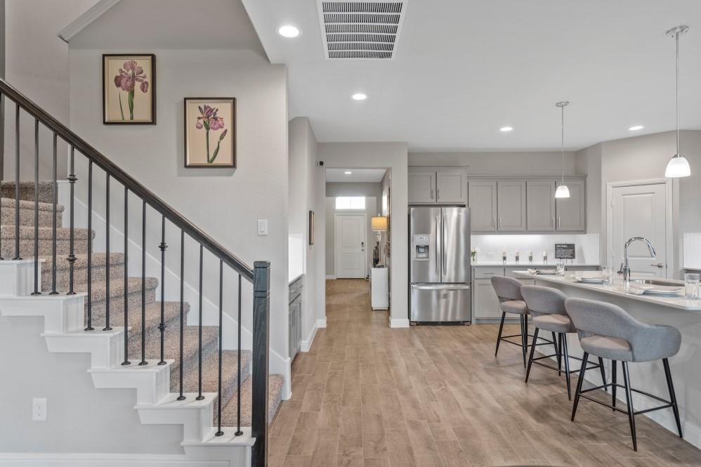 130 Hugo Court Rhome, TX 76078 - Photo 10 of 40 a kitchen with stainless steel appliances a refrigerator and a table