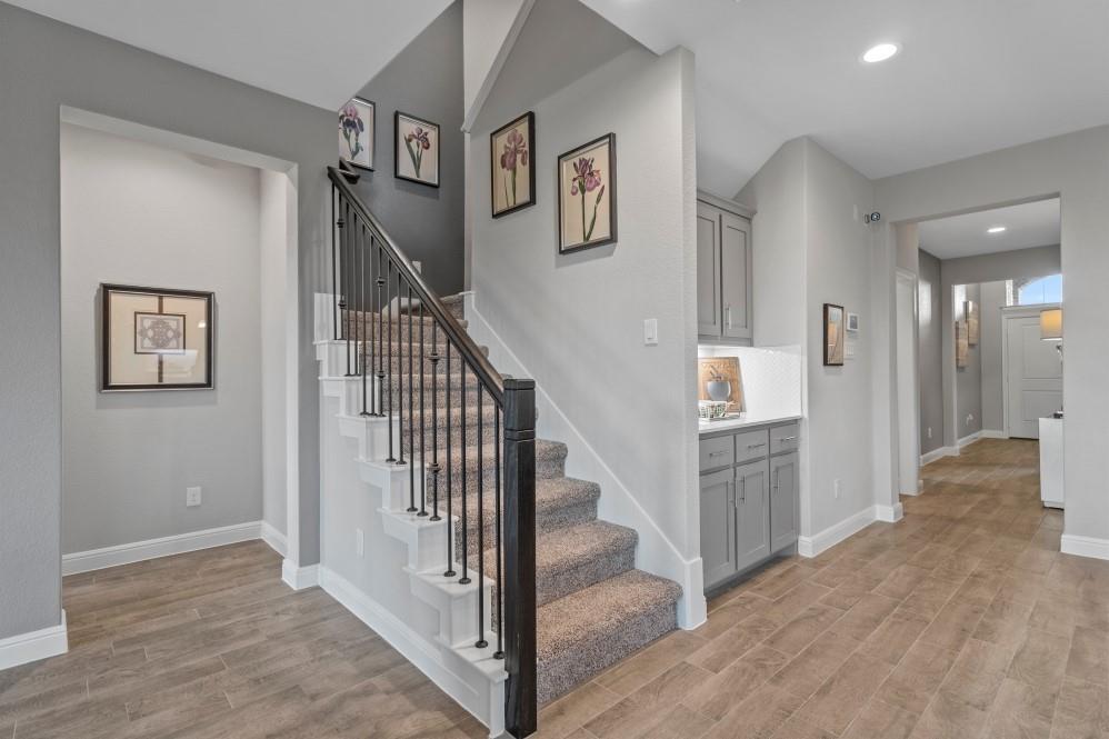 130 Hugo Court Rhome, TX 76078 - Photo 11 of 40 a view of entryway and hall with wooden floor