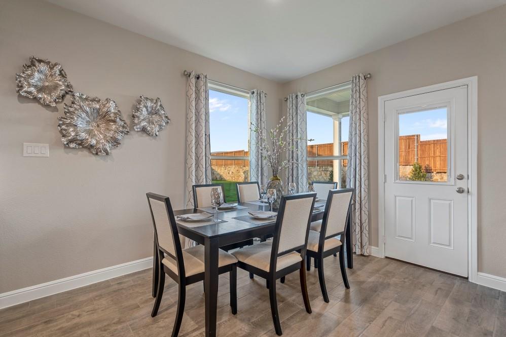 130 Hugo Court Rhome, TX 76078 - Photo 12 of 40 a view of a dining room with furniture and window