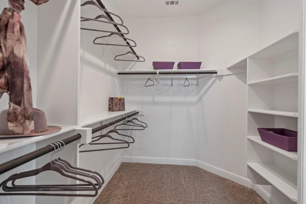 130 Hugo Court Rhome, TX 76078 - Photo 22 of 40 a view of storage and utility room with racks on the wall