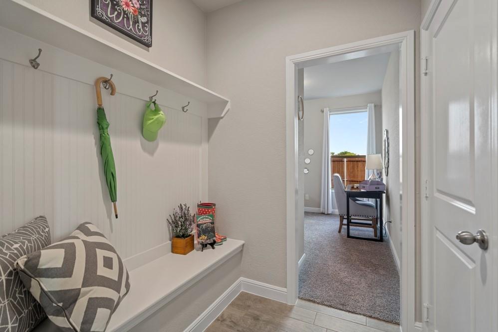 130 Hugo Court Rhome, TX 76078 - Photo 28 of 40 a bedroom with furniture and a table