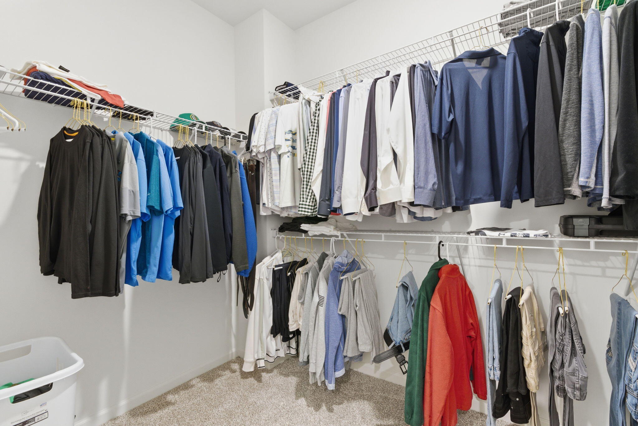 10617 Whitney Place Crown Point, IN 46307 - Photo 11 of 26 a view of walk in closet with clothes