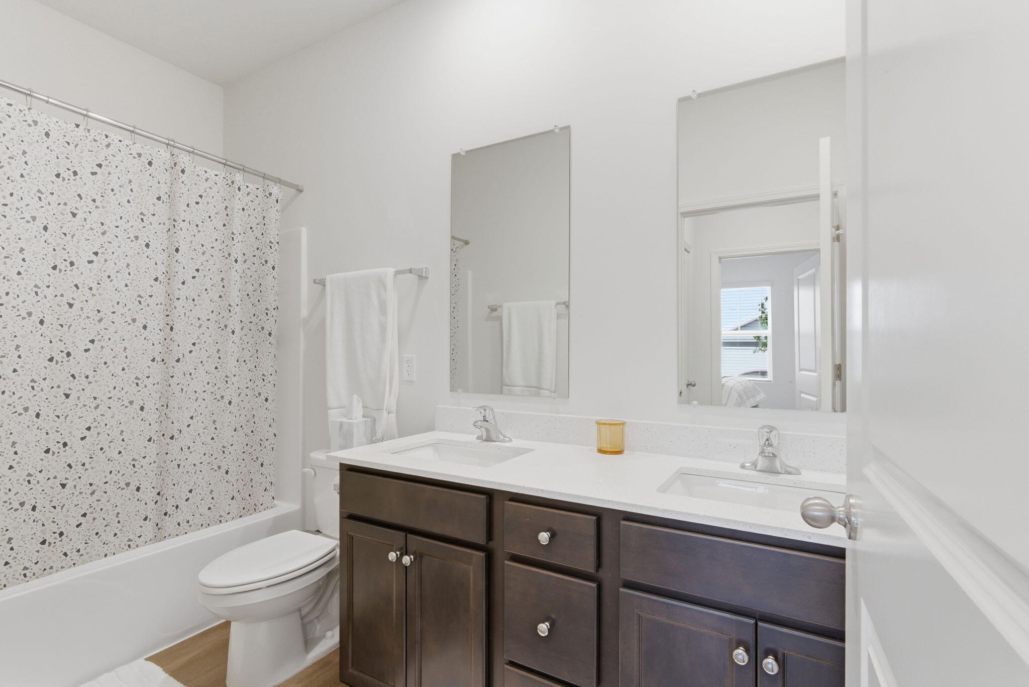 10617 Whitney Place Crown Point, IN 46307 - Photo 16 of 26 a bathroom with a sink a toilet and shower