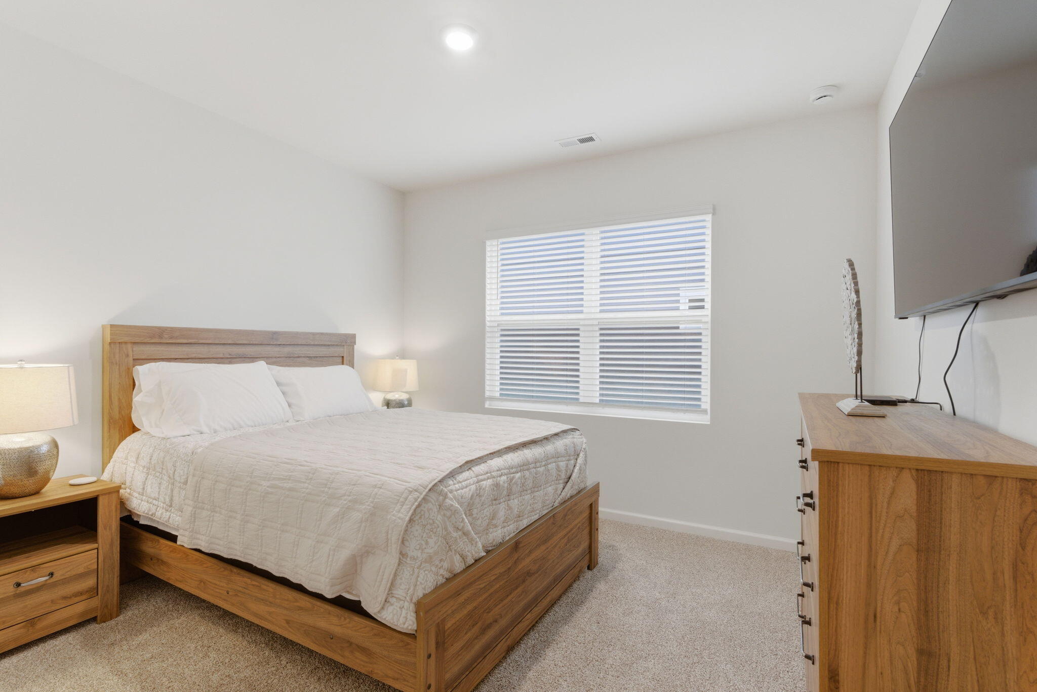 10617 Whitney Place Crown Point, IN 46307 - Photo 17 of 26 a bedroom with a bed and a flat screen tv