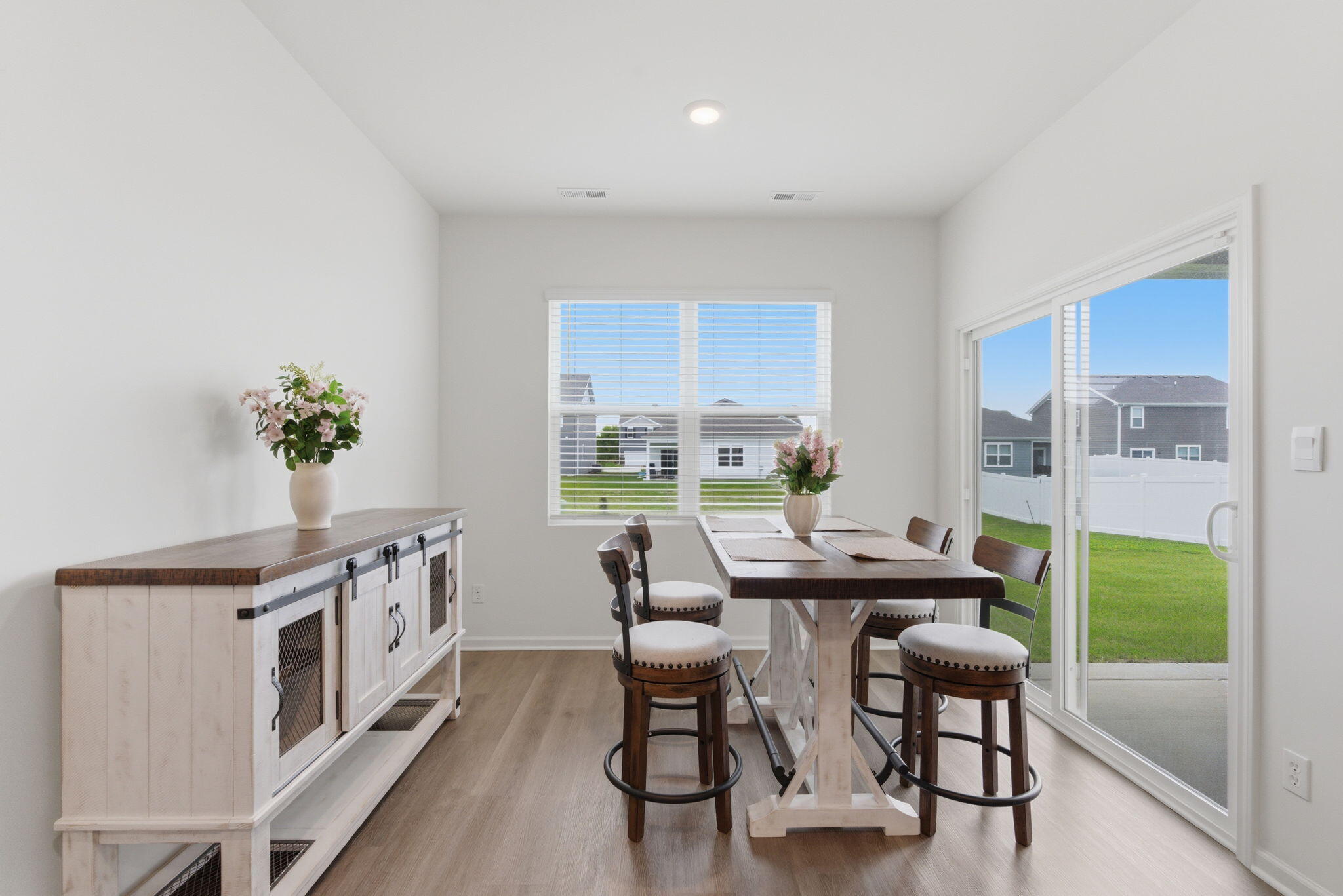 10617 Whitney Place Crown Point, IN 46307 - Photo 6 of 26 a view of a dining room with furniture window and outside view