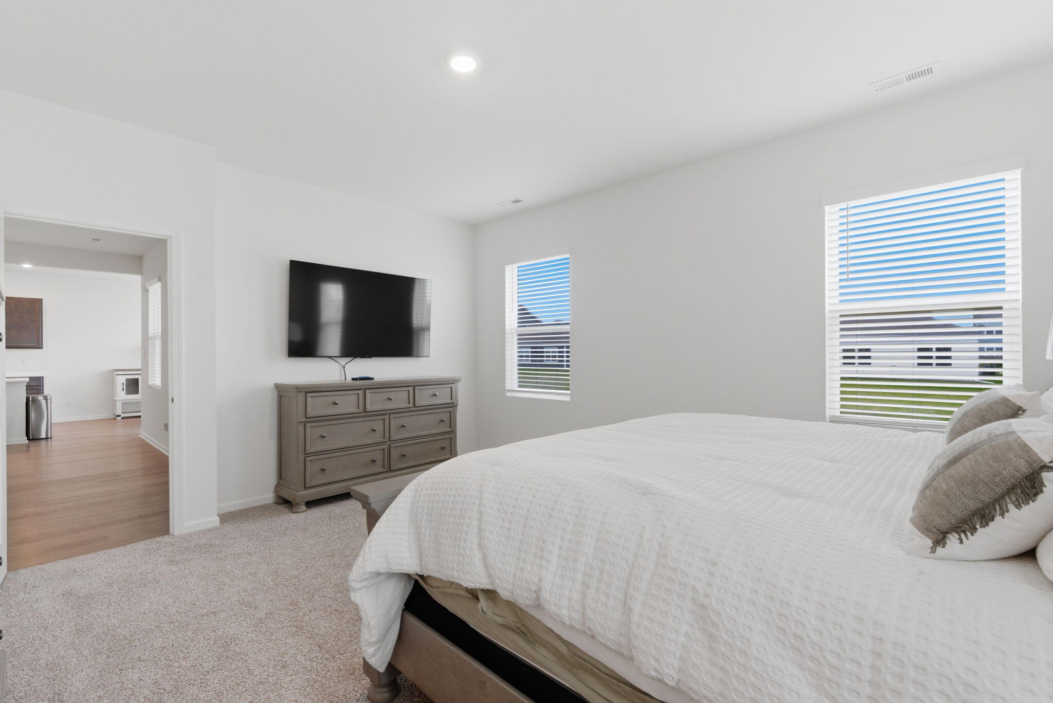 10617 Whitney Place Crown Point, IN 46307 - Photo 10 of 26 a bedroom with a bed and a flat screen tv