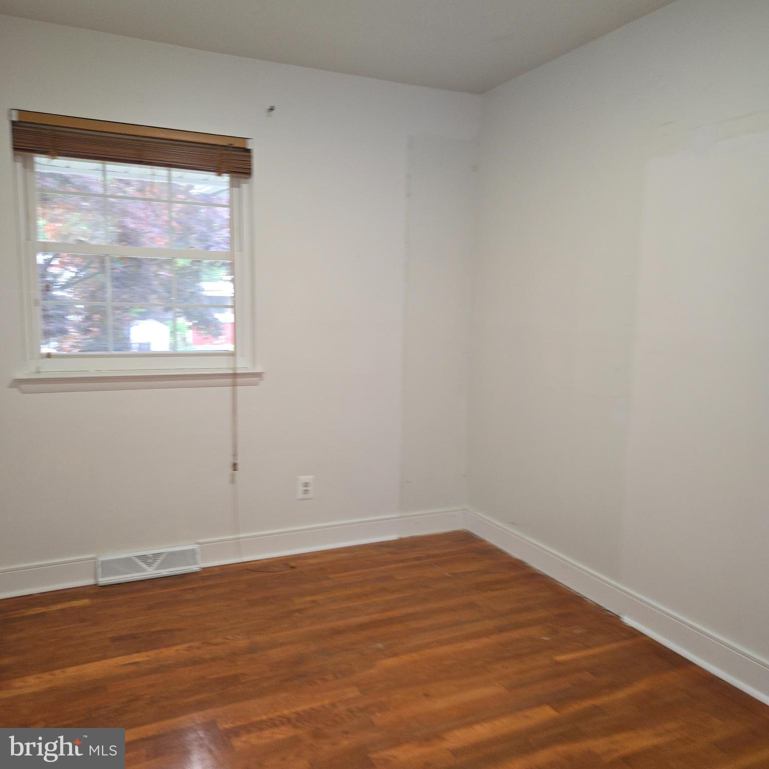3505 Templar Road Randallstown, MD 21133 - Photo 19 of 40 a view of empty room with wooden floor and fan