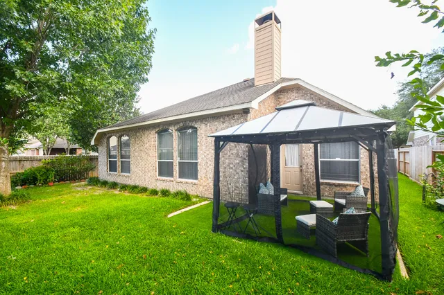 a backyard of a house with lots of green space