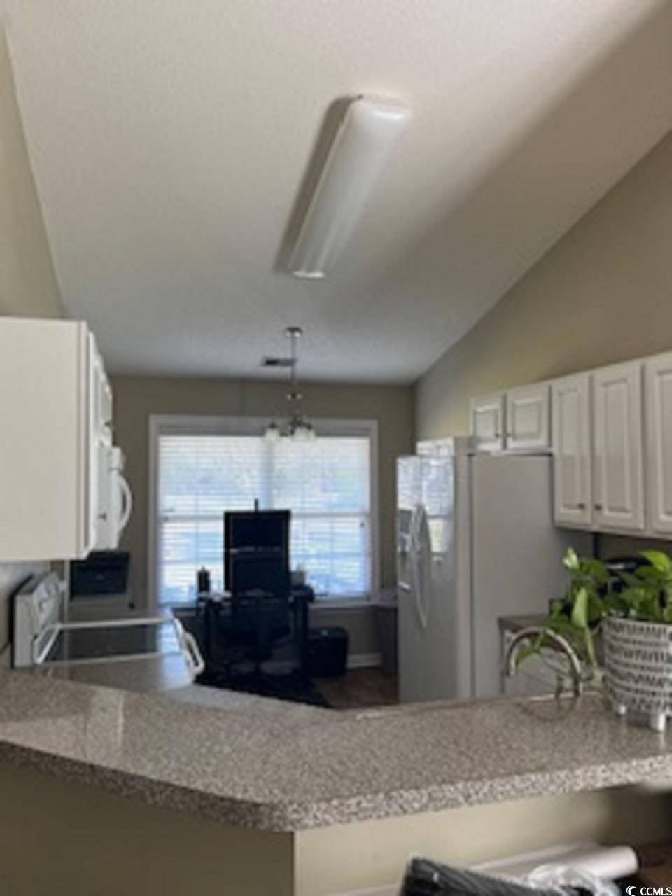 130 Weatherstone Road, Unit 130 Lexington, SC 29072 - Photo 7 of 20 Kitchen with a notable chandelier, hanging light f