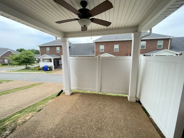 a view of a house with backyard and garage