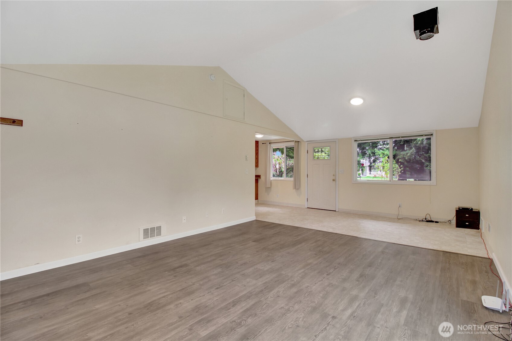 40018 May Creek Road Gold Bar, WA 98251 - Photo 4 of 25 an empty room with wooden floor and windows